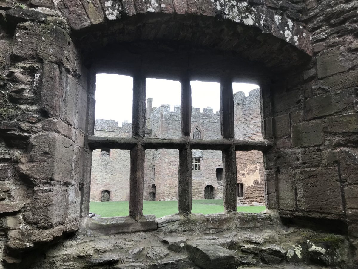 View through a ruined window to the other end of the castle at Ludlow castle