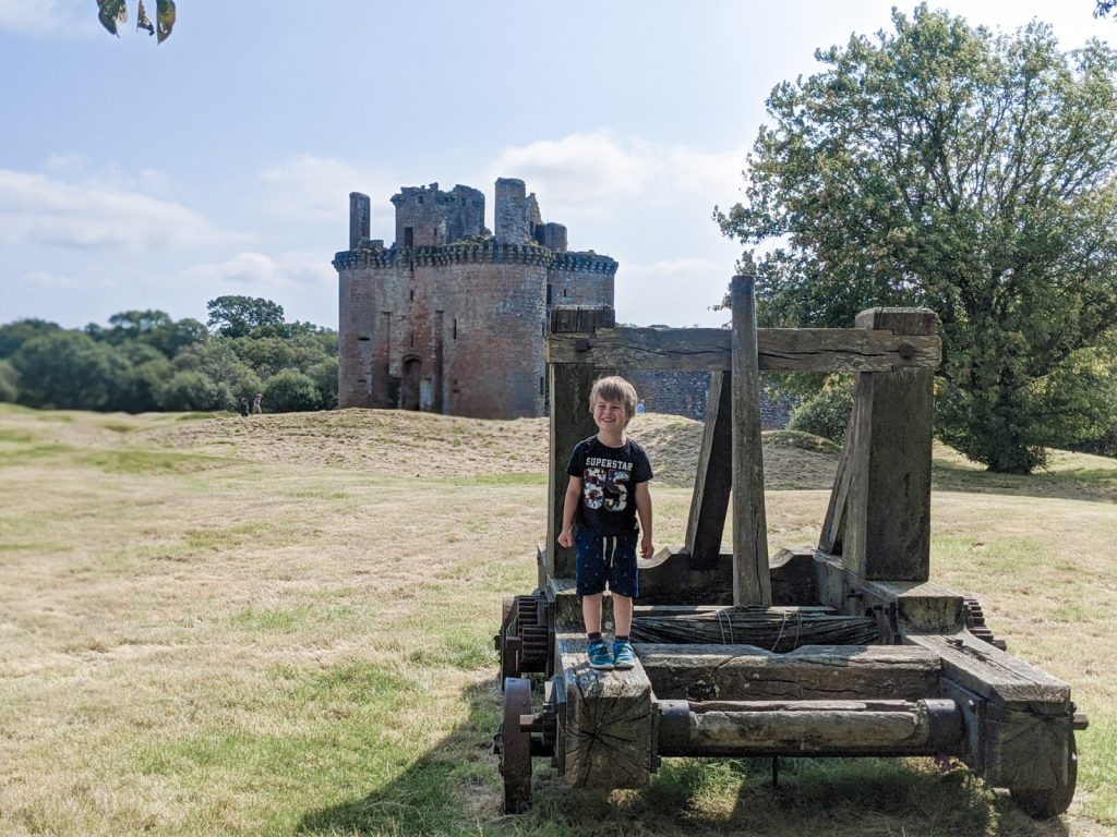 Dexter in front of Caerlaverock castle