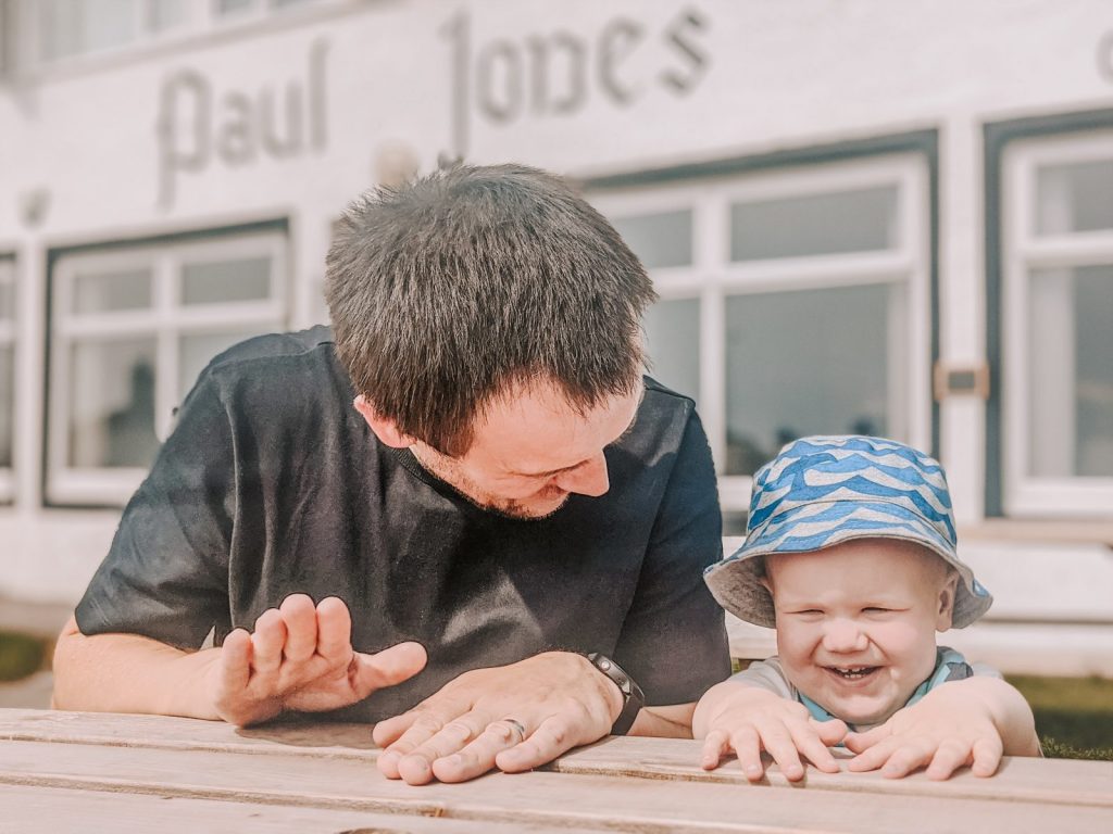 Neil and Felix sat outside the John Paul Jones bar and grill in Southerness