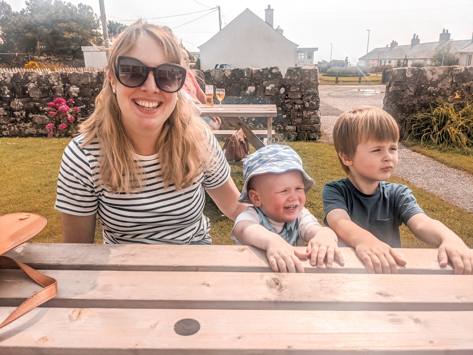 Nicola, Felix and Dexter sat outside John Paul Jones bar and grill in Southerness